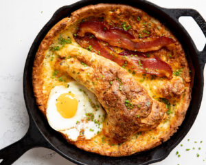 Smoked Cheddar Dutch Baby With Maple Bacon and Fried Eggs featured image